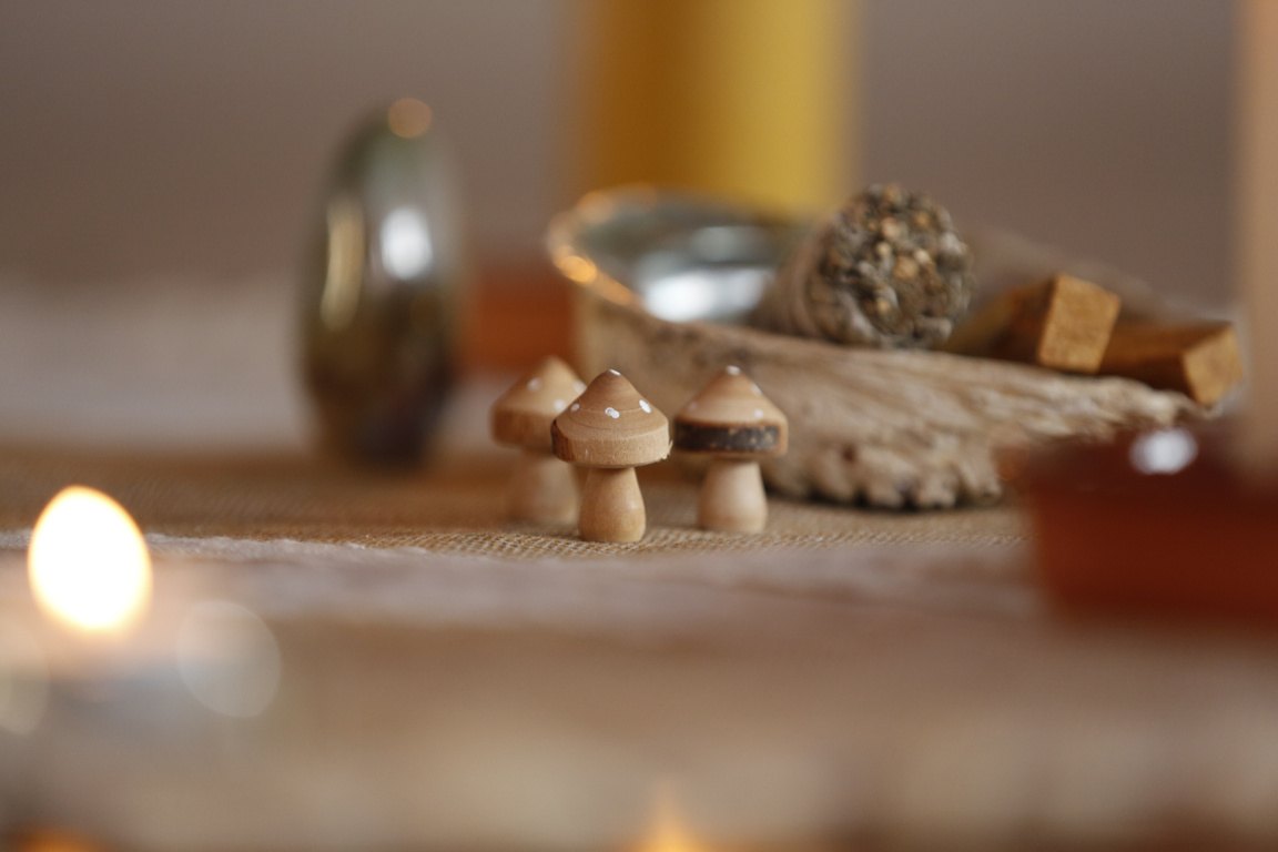 Softly lit ceremony space with natural objects