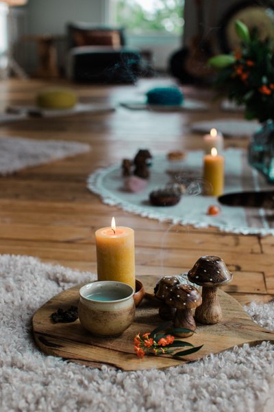 Candles, natural objects and handmade ceramics arranged for a retreat